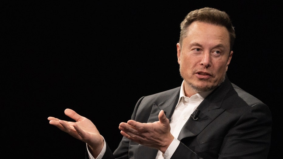 Elon Musk speaks at a tech fair