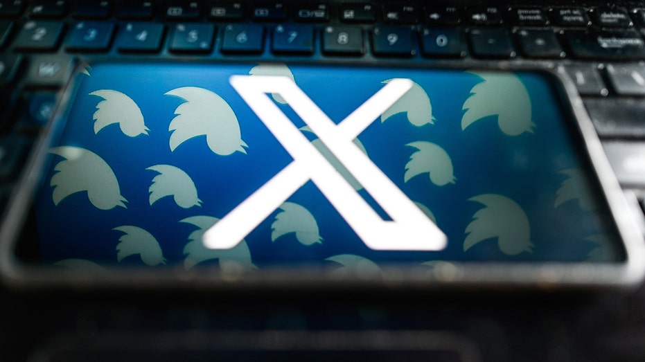 X logo on phone