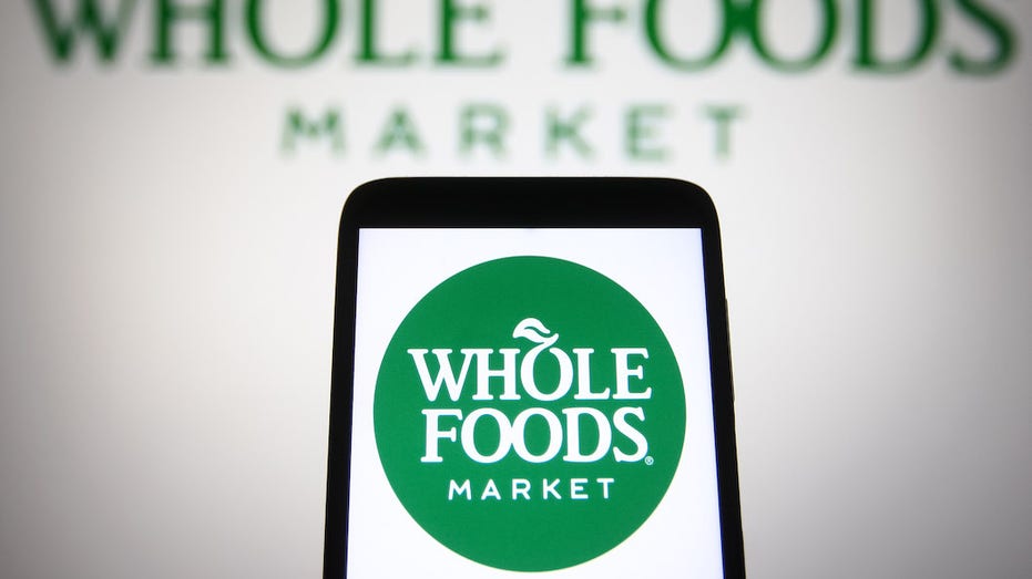 Photo of Whole Foods logo on smartphone